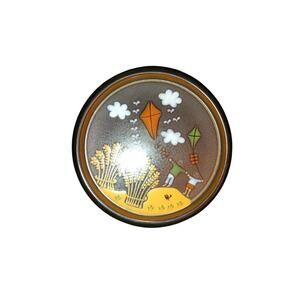 vintage KMK Pottery Plate featuring a whimsical "Flying Kites"